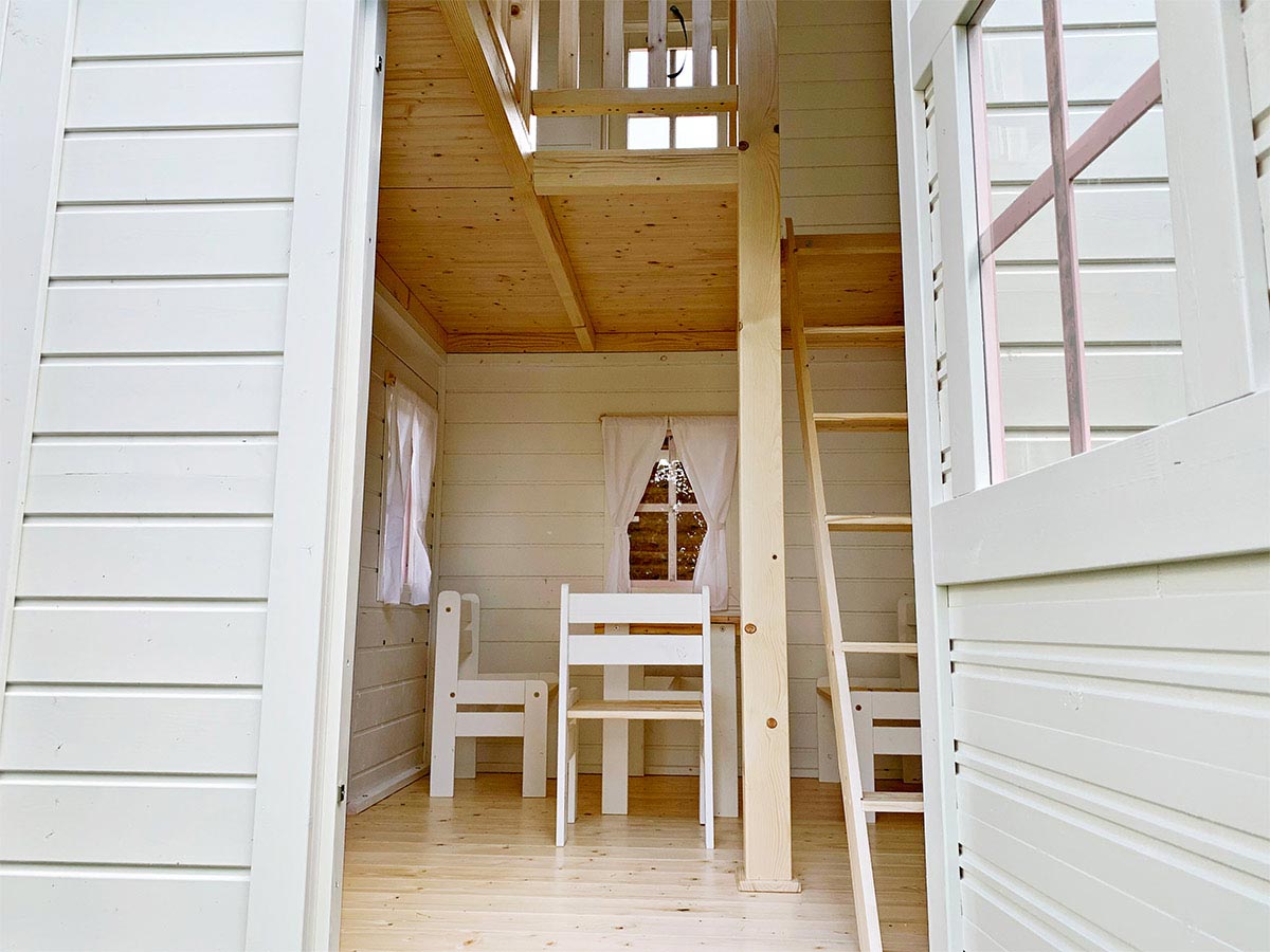 KidsPlayHouses_EU double solid wood kids playhouse Princess interior view, stairs to second floor and kids furniture