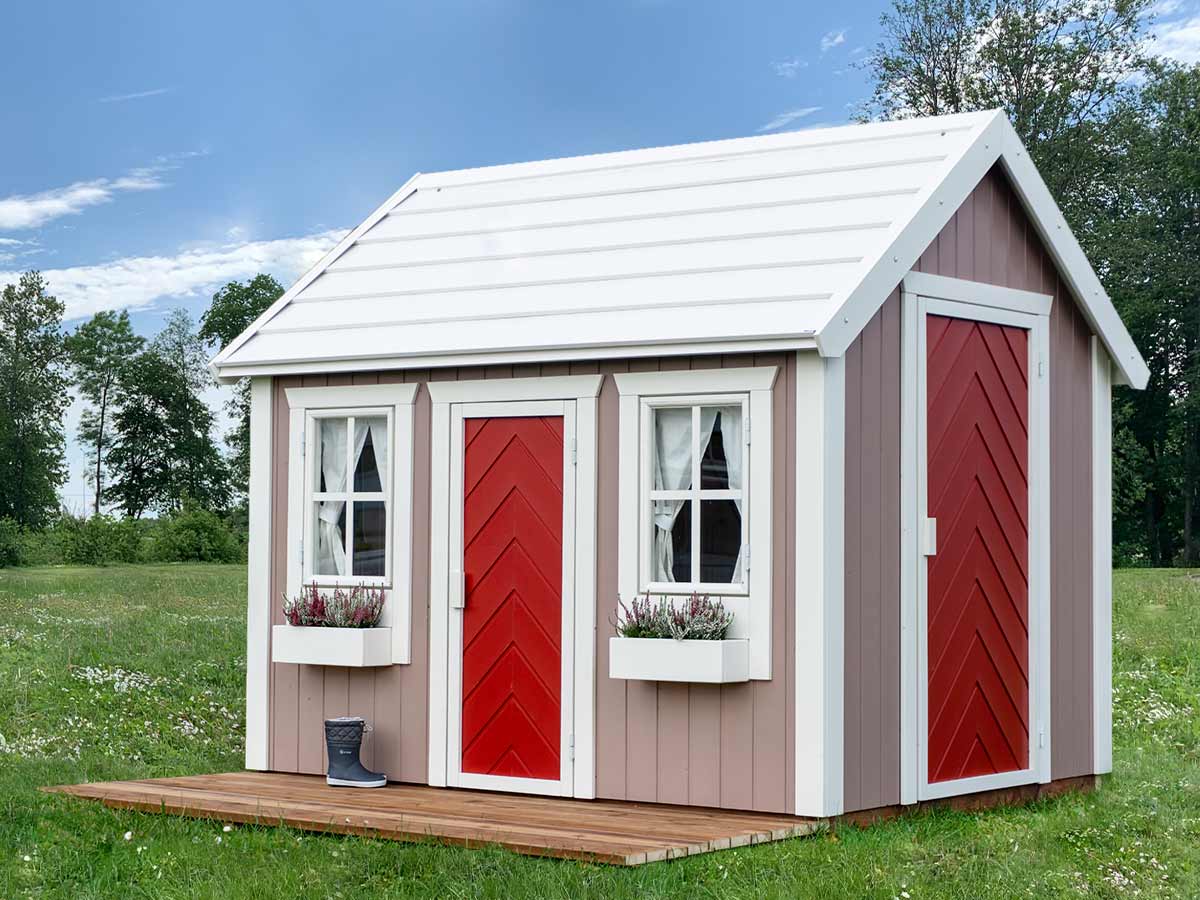 Play house with beige walls, white window frames and red herringbone patterned doors Plum by KidsPlayHouses_EU