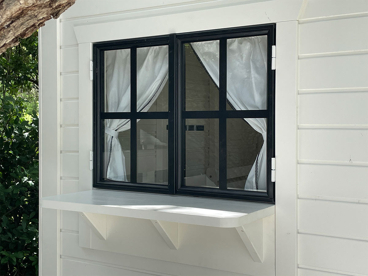 Play Store Window with Black Frame and White Color Counter and white curtains on a white wall