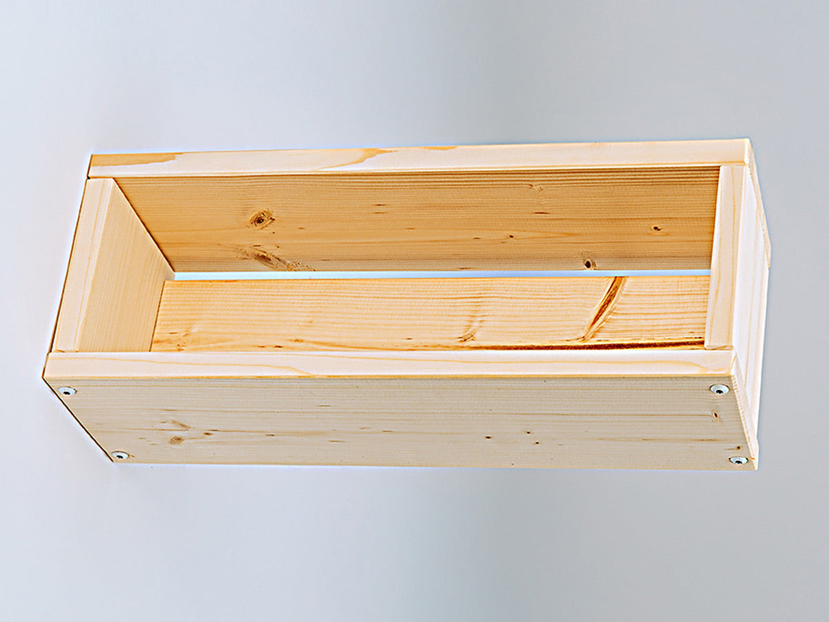 Wooden flower box on a light gray background