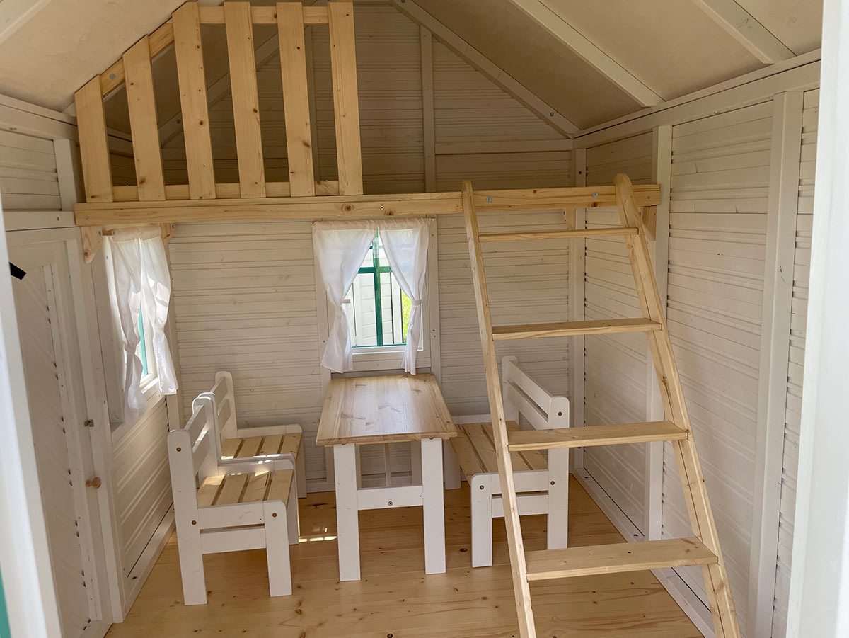 Kids playhouse interior view with loft, stairs and kids furniture