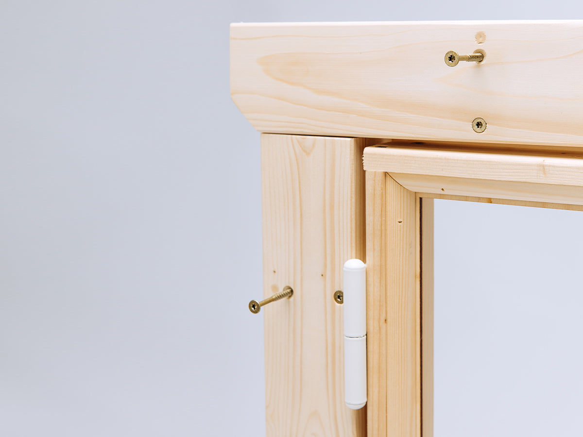 Wooden Playhouse Window frame with hinges on a light gray background
