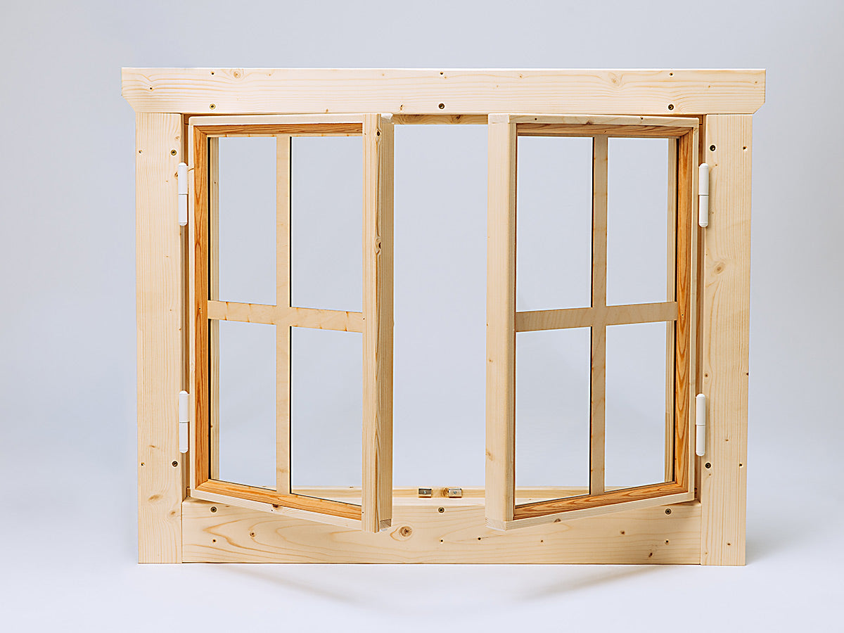 Wooden play store double side window frame with glass panes on a light gray background