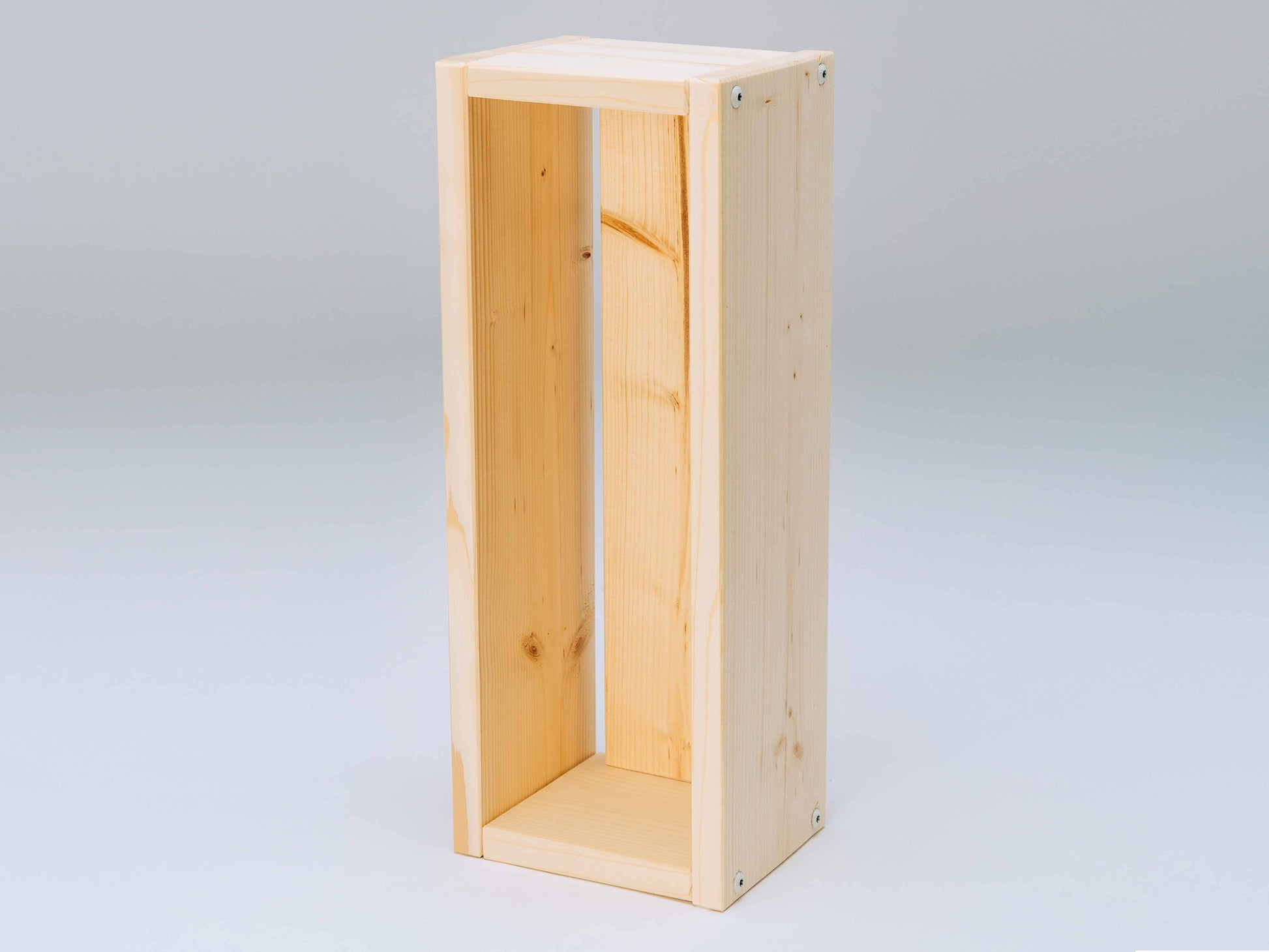 Plain wooden flower box on a light gray background