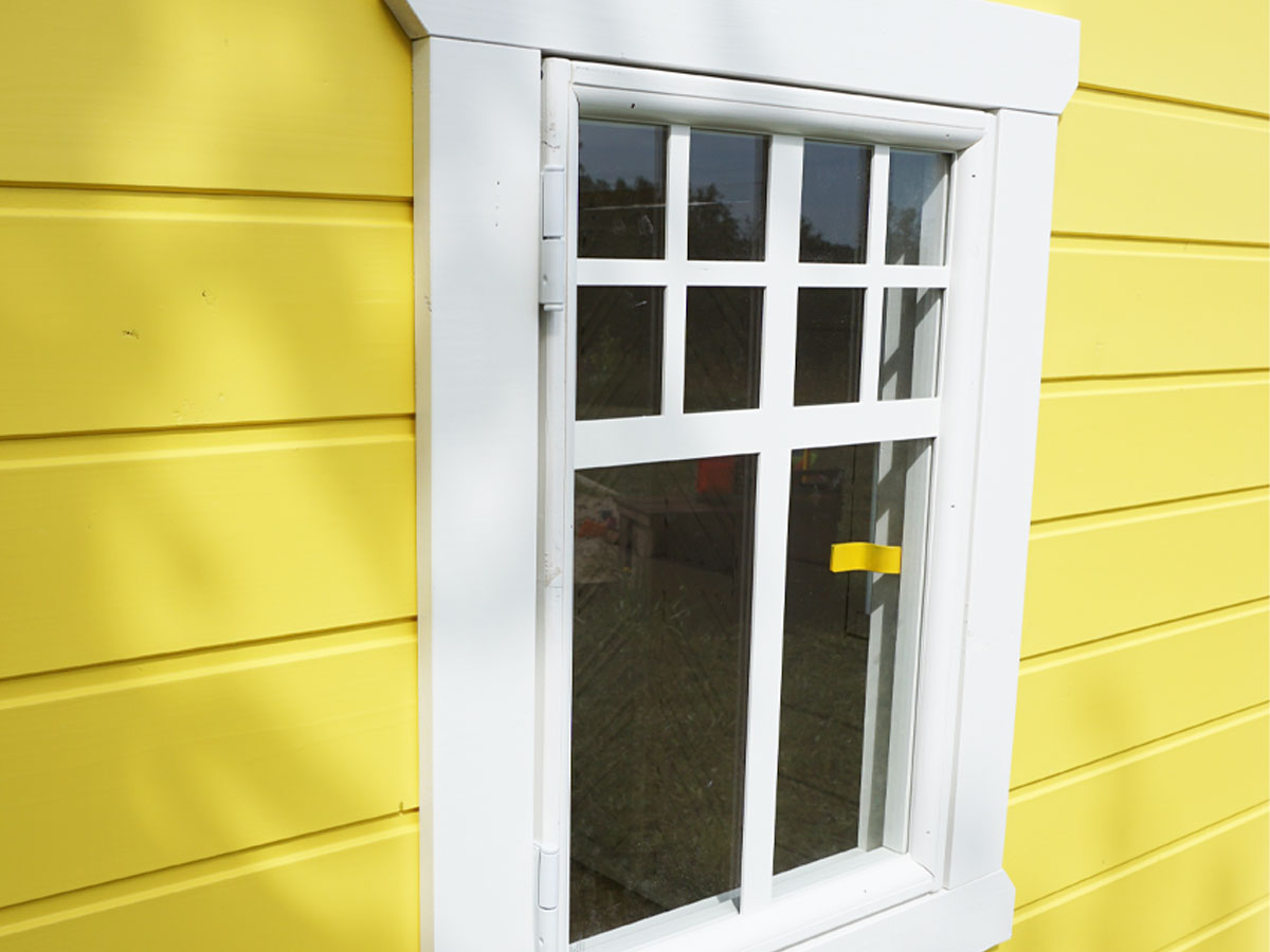 KidsPlayHouses_EU solid wood yellow functioning Sunny Sadie with white framed opening window.