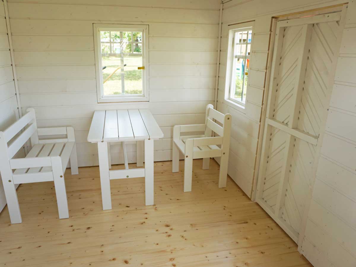 KidsPlayHouses_EU solid wood yellow playhouse Sunny Sadie with childrens furniture.
