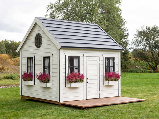KidsPlayHouses_EU Solid wood white playhouse Arctic XL with flower boxes, brown coloured impregnated wooden decking and opening windows, on lawn